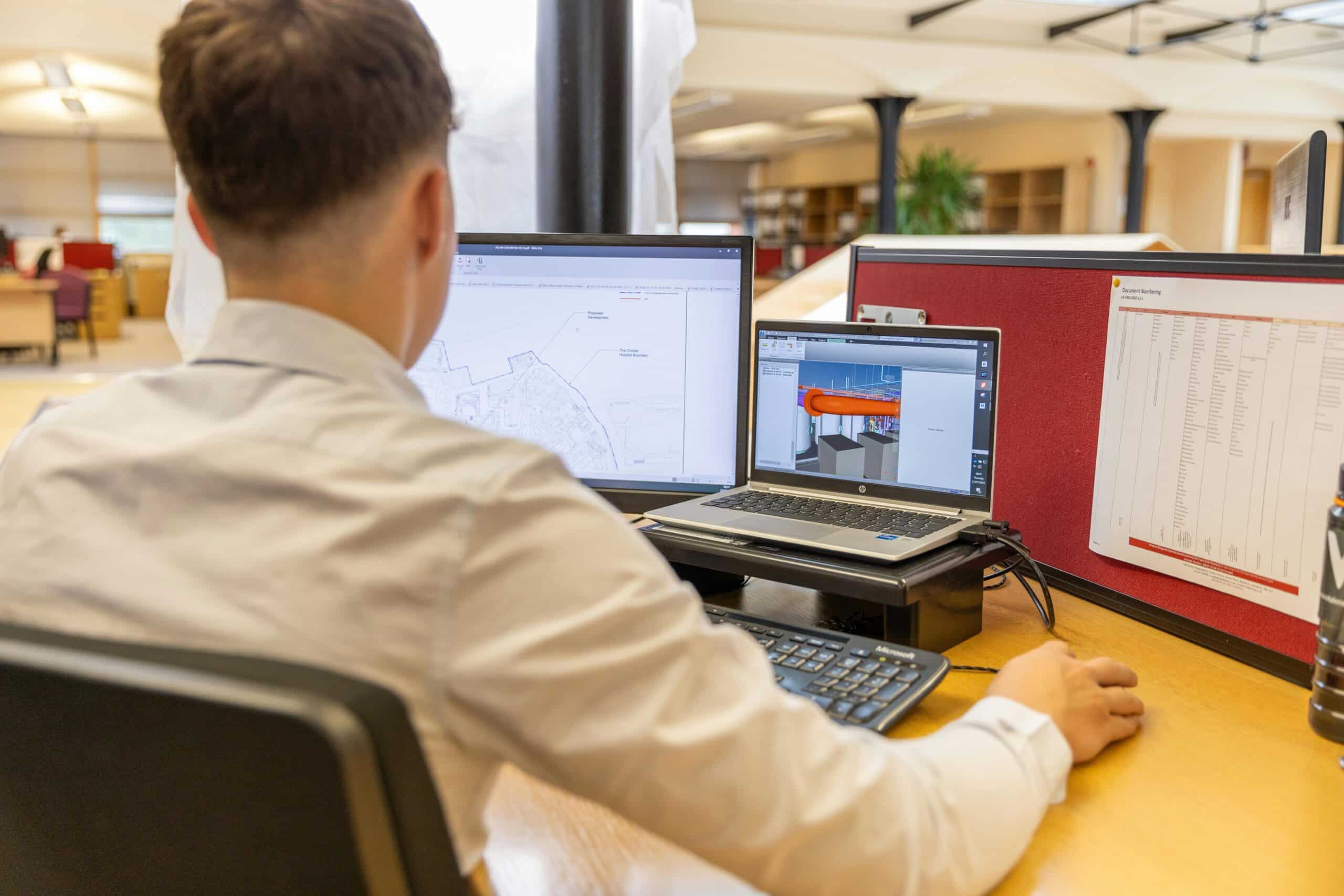 Engineering at desk with CAD program